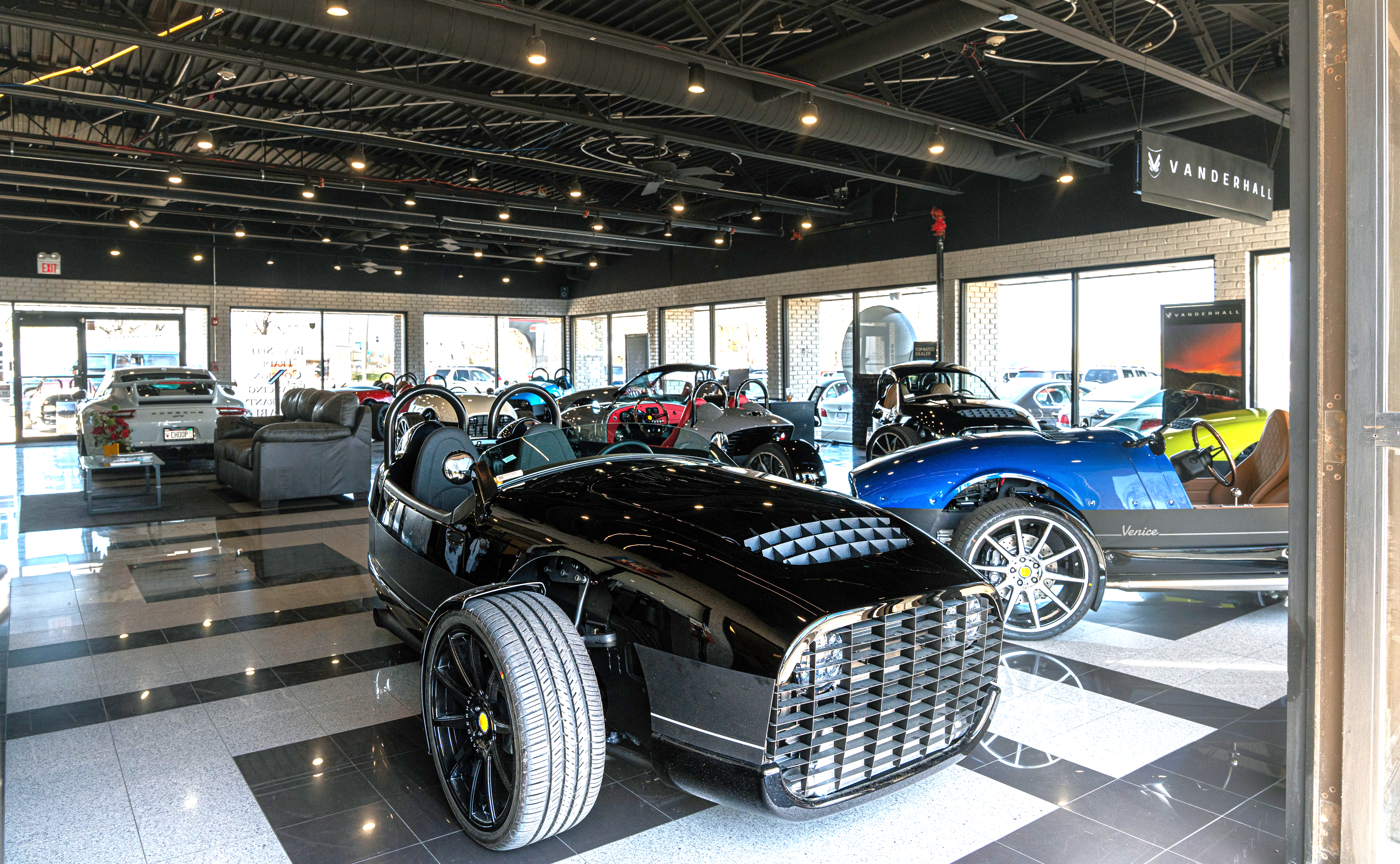 Black Vanderhall trike inside Premiere Motorsports Chicago's Plainfield dealership.